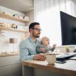 Dad and baby in front of computer